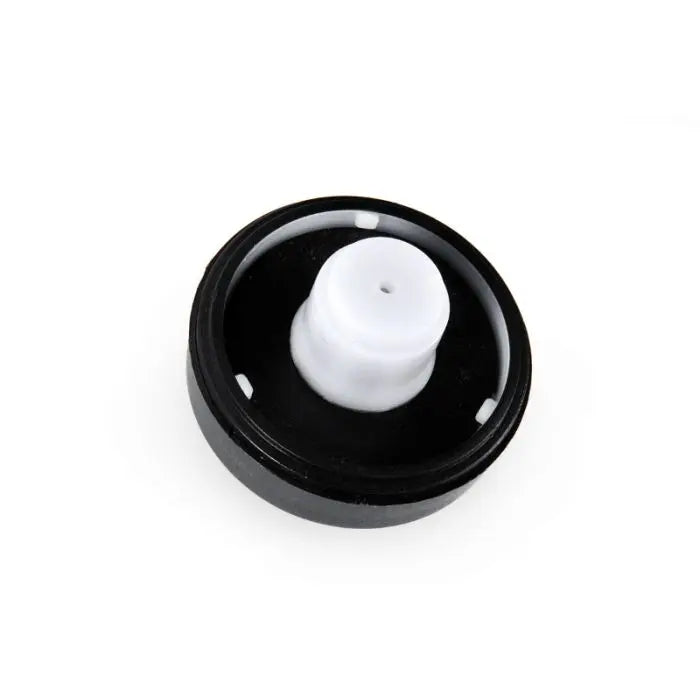 Black cap with a white nozzle on a white background