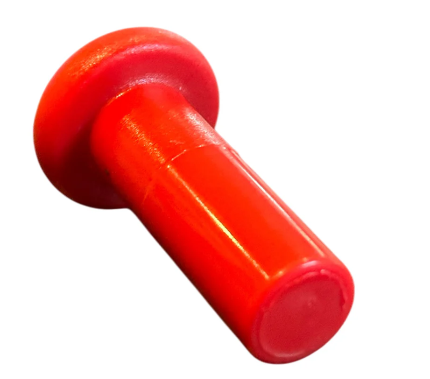Red plastic toggle bolt on a white background