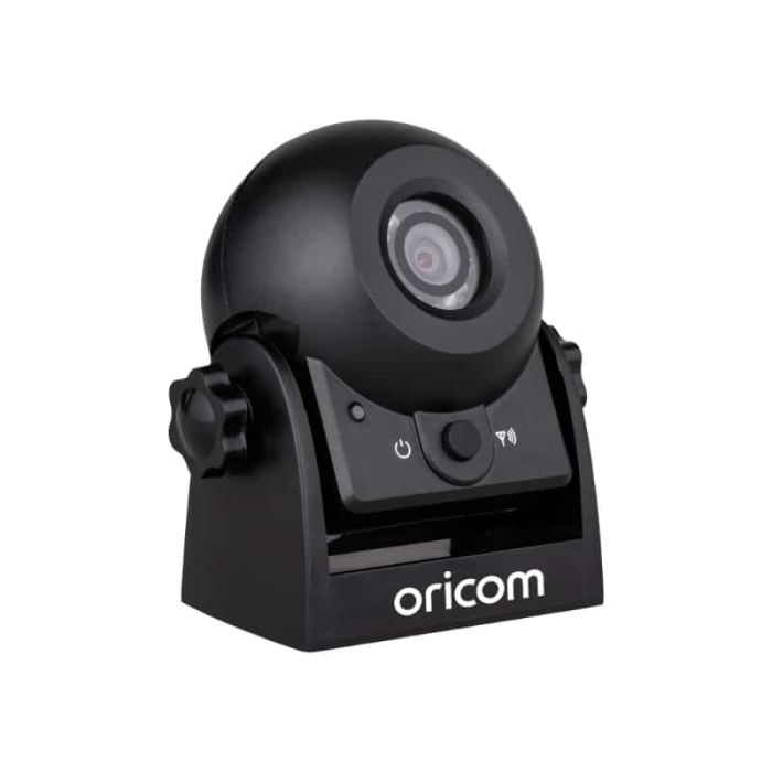 A black Oricom wireless camera with visible control buttons and a mounting bracket.