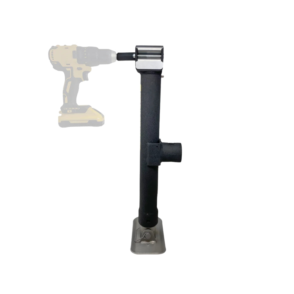 Black drill bit holder attached to a drill on a white background