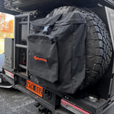Black tire cover with Wildtrak logo on a vehicle tire