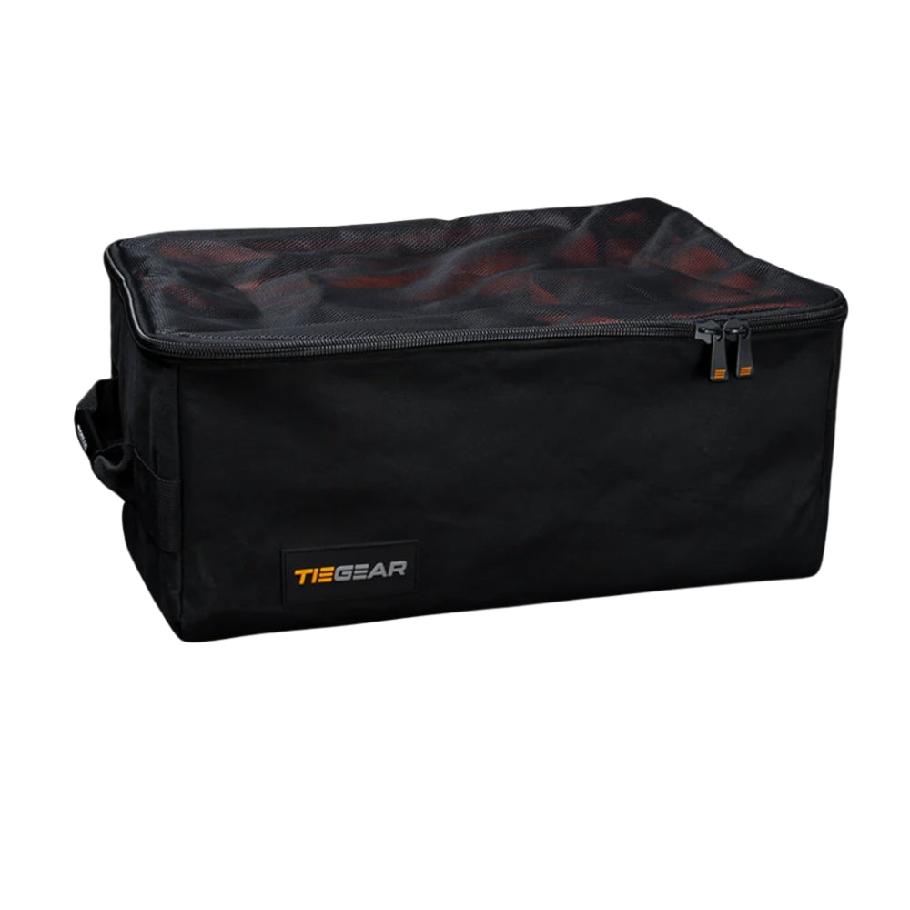 Black duffel bag with orange zipper and 'TieGear' logo on a white background