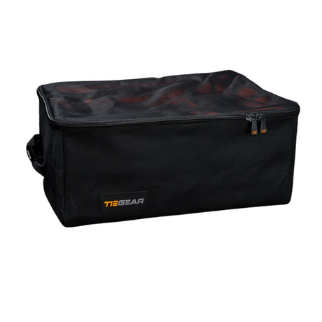 Black duffel bag with orange zipper and 'TieGear' logo on a white background