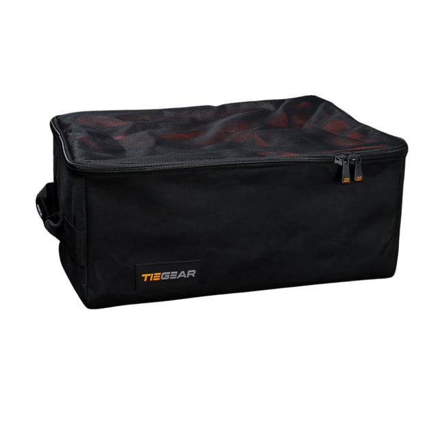 Black duffel bag with orange zipper and 'TieGear' logo on a white background