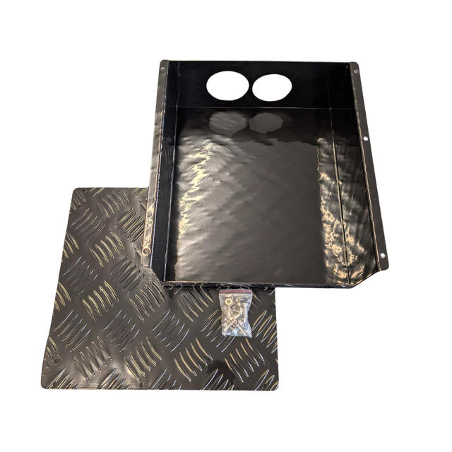 Black metal fuel tank cover with textured surface on a white background