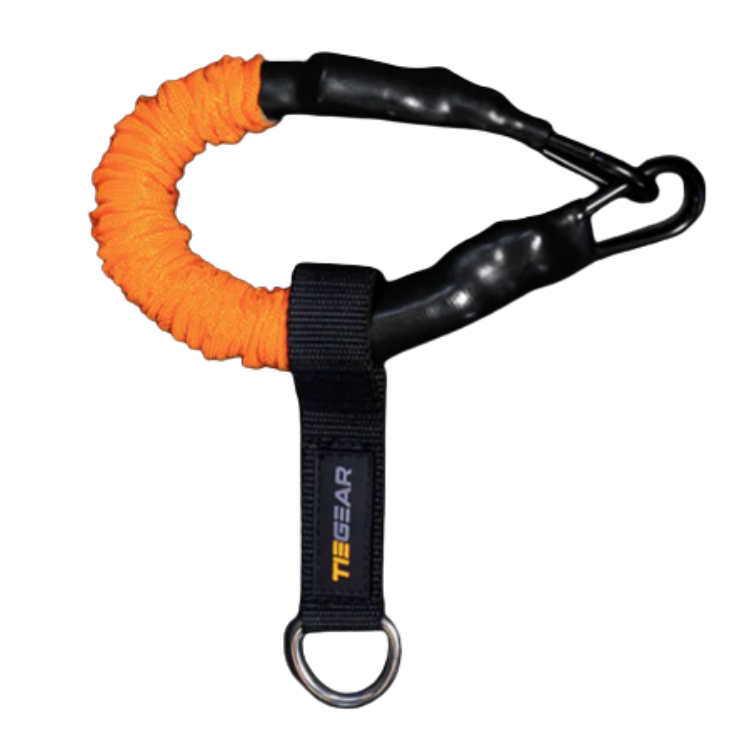 Orange and black soft spring with carabiner on a white background